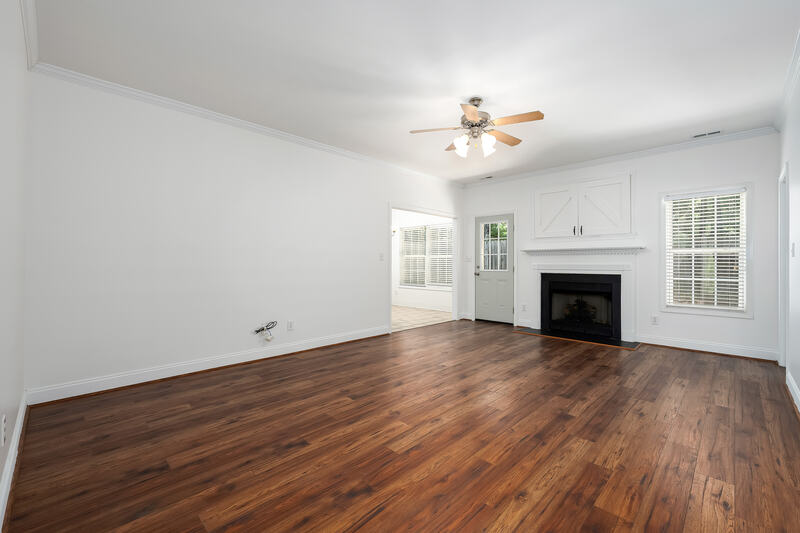 Great room with a gas fireplace and hardwood floors