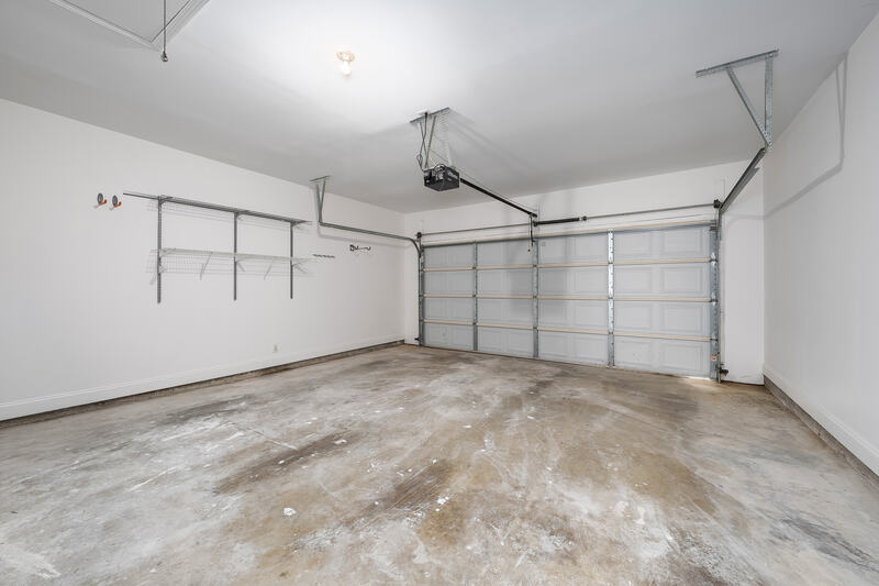 Two-car garage with storage shelving